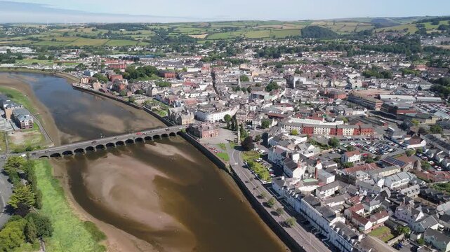Aerial fly over the River Taw and Barnstaple town in North Devon looking down to Barnstaple Bridge