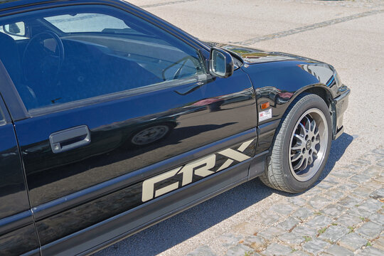 Black honda civic crx parked on cobblestone street