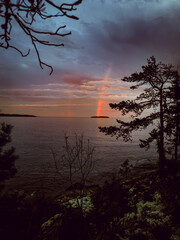 Lake Ladoga at sunset with a rainbow in Karelia.