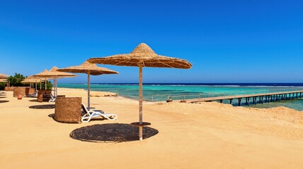 Idylic beach with sun umbrelas, Red Sea, Egypt
