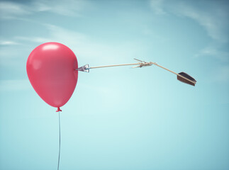 Broken arrow aiming at a red balloon, symbolizing focus