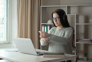A young beautiful girl works in an office, makes an accounting report.