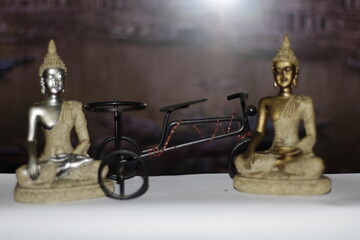Serene Buddha Statue on empty colorful backdrop with copy space, yoga, meditation and relaxation...