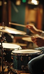 Naklejka premium A drummer plays a drum set in a studio.