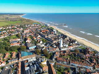 Obraz premium Aerial view of the famous Suffolk coastal town of Southwold. The tall white lighthouse can be seen looking out to the North Sea.