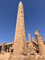 Ancient Egyptian Obelisk at  Temple under Clear Blue Sky in Egypt