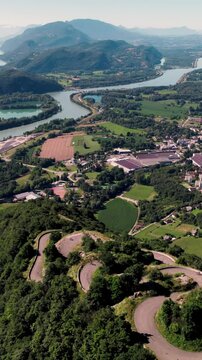 Aerial vertical footage of Lacets du Grand Colombier, and the town of Culoz in Ain, France