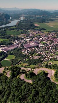 Ascending aerial vertical footage of the Lacets du Grand Colombier, in the town of Culoz, France