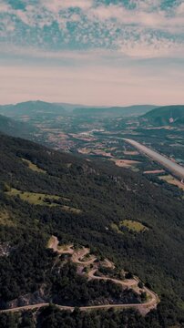 Vertical aerial footage of the Lacets du Grand Colombier in Culoz town in the Ain department, France