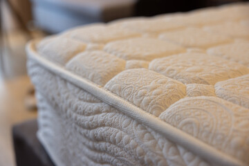 A white mattress with a white border