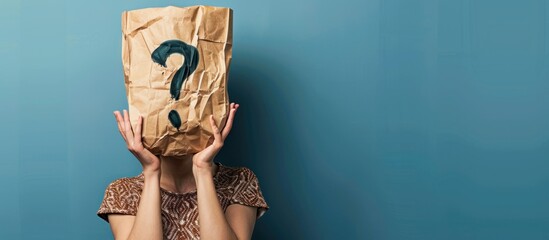 Portrait of a person with his head covered with shopping bags with a question mark symbol