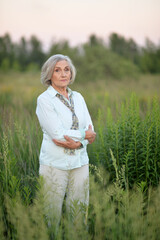 Beautiful woman in the park in summer