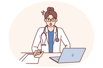 Shocked woman doctor is surprised to see rare disease, sits at table with laptop. Girl doctor with stethoscope, opening mouth looks at screen after learning about symptoms of mysterious disease