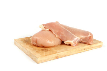 raw chicken fillet on chopping board  isolated 