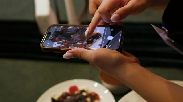 take pictures of food Food blogger female hands photographing food delicious italian lunch salad caprice with sauce pasta mozzarella and tomatoes and also salad with jamon prosciutto