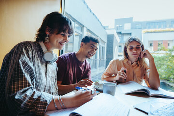 High school friends studying together on a city campus, collaborating and enjoying a group homework session