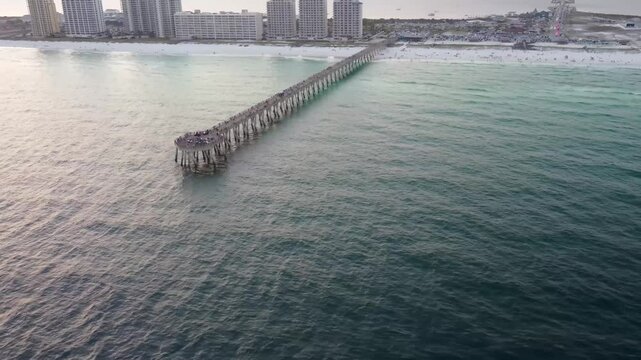 Aerial view of Navarre pier Pier, Navarre Beach along Florida's Gulf Coast. Navarre Beach pier's is famous for is being longest fishing pier in Florida, stretching 1,545 feet long 30 feet above water.