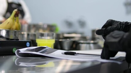 cooking lesson write down recipe black pen in hands of cook in kitchen master class training cook lesson