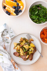 Stewed duck fillet with potatoes and asparagus and radishes, mixed salad of various greens, baked carrots in tahini sauce