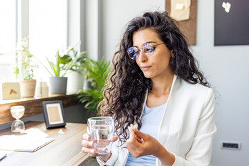 Confident Professional Woman Taking a Break in Modern Office
