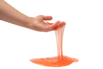 Red slime toy in man hand isolated on white.