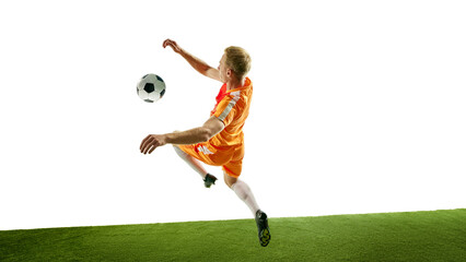 Athlete stretches mid-air, performing intense kick, illustrating control and precision as ball...