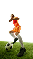 Moment before impact. Football player positions himself for perfect strike, keeping his eyes locked on ball as it rolls forward. Concept of competition, sport games, movement, energy. Ad.