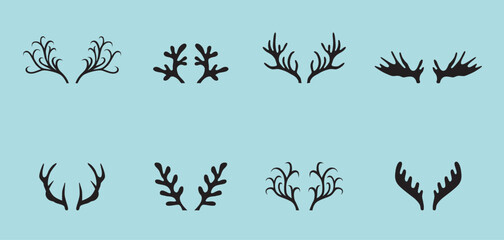 Deer antlers collection isolated on blue background.