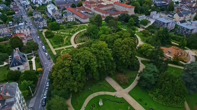 Thabor gardens at Rennes in France. Aerial drone backward