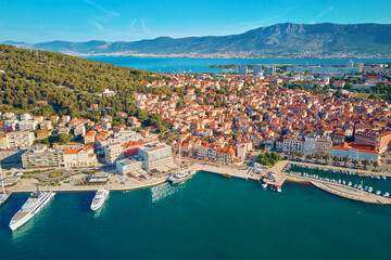 Aerial view of Split, Croatia. Cityscape of coastal touristic city with harbor with mountains in...