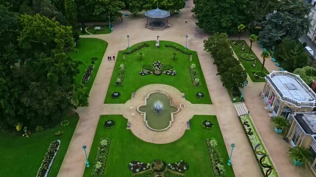 Thabor gardens with fountains and flower beds, Rennes in France. Aerial drone backward ascending