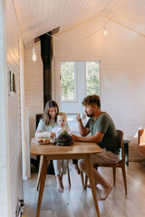 Family breakfast at home with fresh croissants, grapes, and coffee, enjoying quality time together