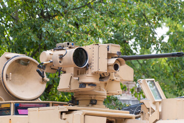 Machine gun on the roof of a modern tank, close-up.