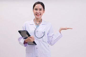 Smiling female doctor holding tablet on white background.