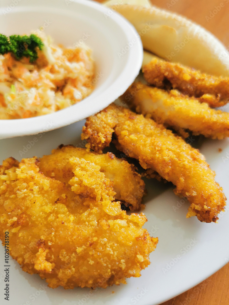 Poster chicken strips and vegetable salad