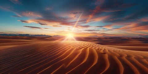 Stunning sunset over golden sand dunes with dramatic clouds in the vast desert landscape at twilight.