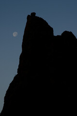 Rocky cliff and moon at sunset. The Nublo Rural Park. Tejeda. Gran Canaria. Canary Islands. Spain.