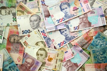 Big amount of different ukrainian hryvnia currency money bills in pile
