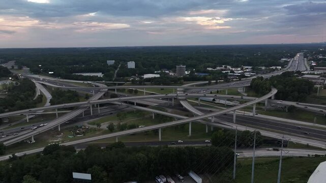 Evening traffic on Spaghetti Junction Interstate corridor, intersection of Interstates 85 and 285 in Atlanta, Georgia, Drone shot
