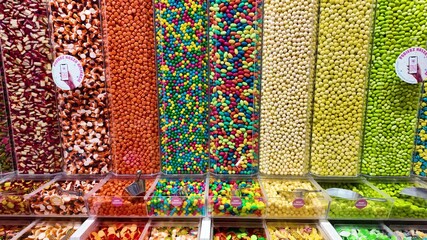 Close-up of colorful candy assortment in a shop, vibrant sweets with various shapes and sizes, inviting and playful