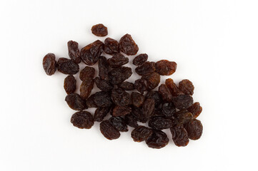 A close-up of raisins on a white background photographed from above.