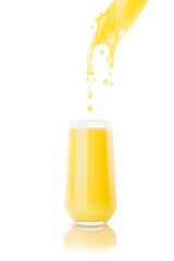 Flow of orange juice pour in drinking glass with flying drops, splashes of juice on white background, isolated. Fresh yellow mango juice for advertising, label product, branding, flyer, design, card.