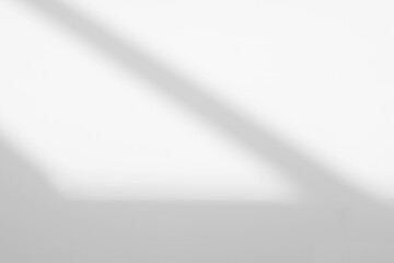Abstract light reflection and grey shadow from window on white wall background. Gray stripe window shadows and sunshine diagonal geometric overlay effect for backdrop and mockup design