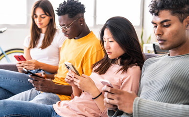 Multiracial young people using smart mobile phone device - Technology and social media life style concept