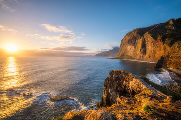 View of Madeira scenic cliffs coastline landscape on sunrise, Guindaste viewpoint, Madeira island, Portugal
