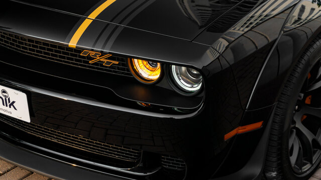 Black Dodge Challenger RT headlight close up, American Muscle Car front end