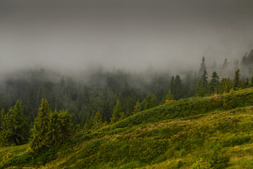 view of the Alps with fog and clouds