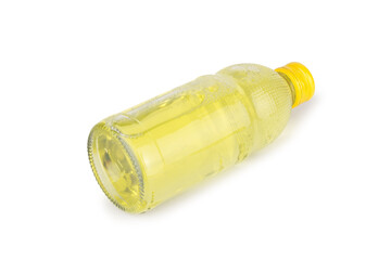 Glass bottle, yellow water isolated on white background