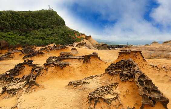 Beautiful Yehliu Geopark on a sunny day, New Taipei City, Taiwan. Yehliu Geo-park features all sorts of strange-looking rocks. It is part of Datun Mountain that stretches out to the sea