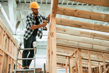 Industrial worker in wooden warehouse